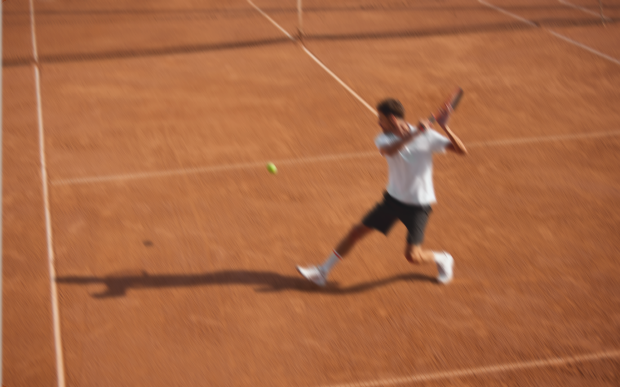 person returning a tennis swing