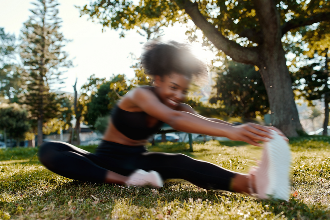 Girl stretching in a park