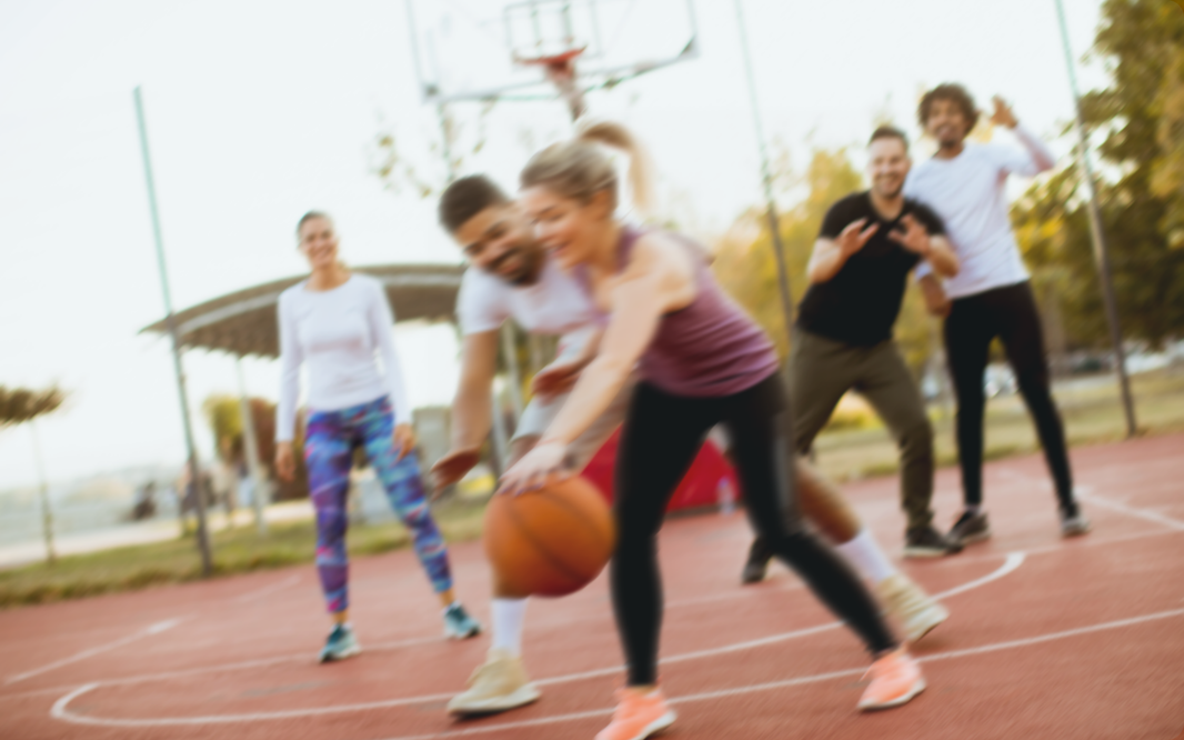 group of people playing basketball