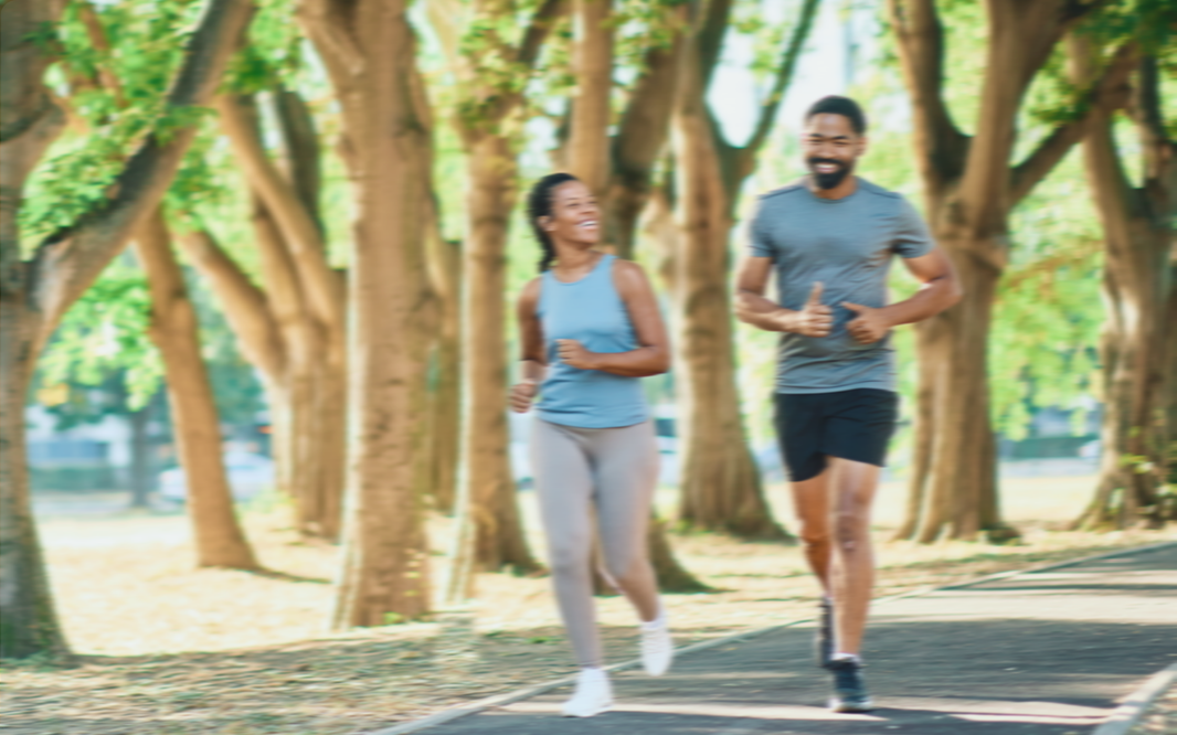 two people running on a trail