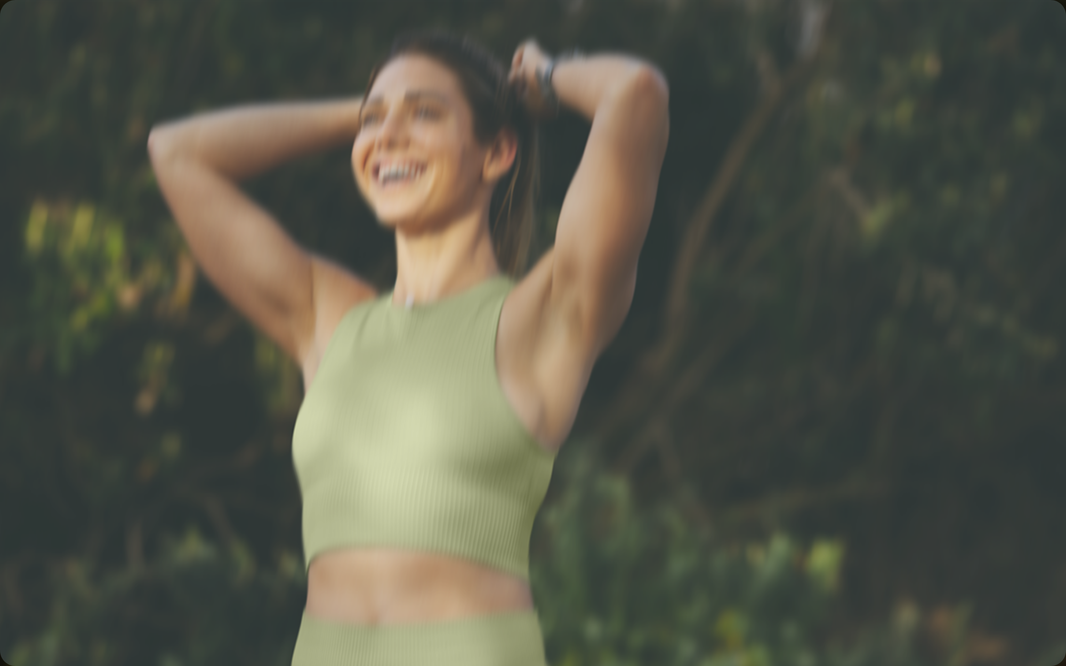 woman trying back her hair after a workout